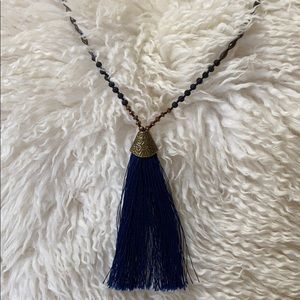 Threaded strands and beaded necklace